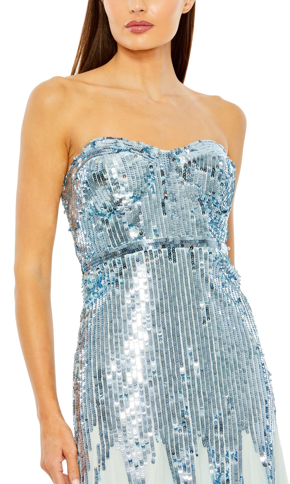 A woman wears the Mac Duggal 93959 Strapless Sequin Formal Dress, adorned with light blue and silver vertical sequins—an eye-catching evening gown ideal for formal occasions.